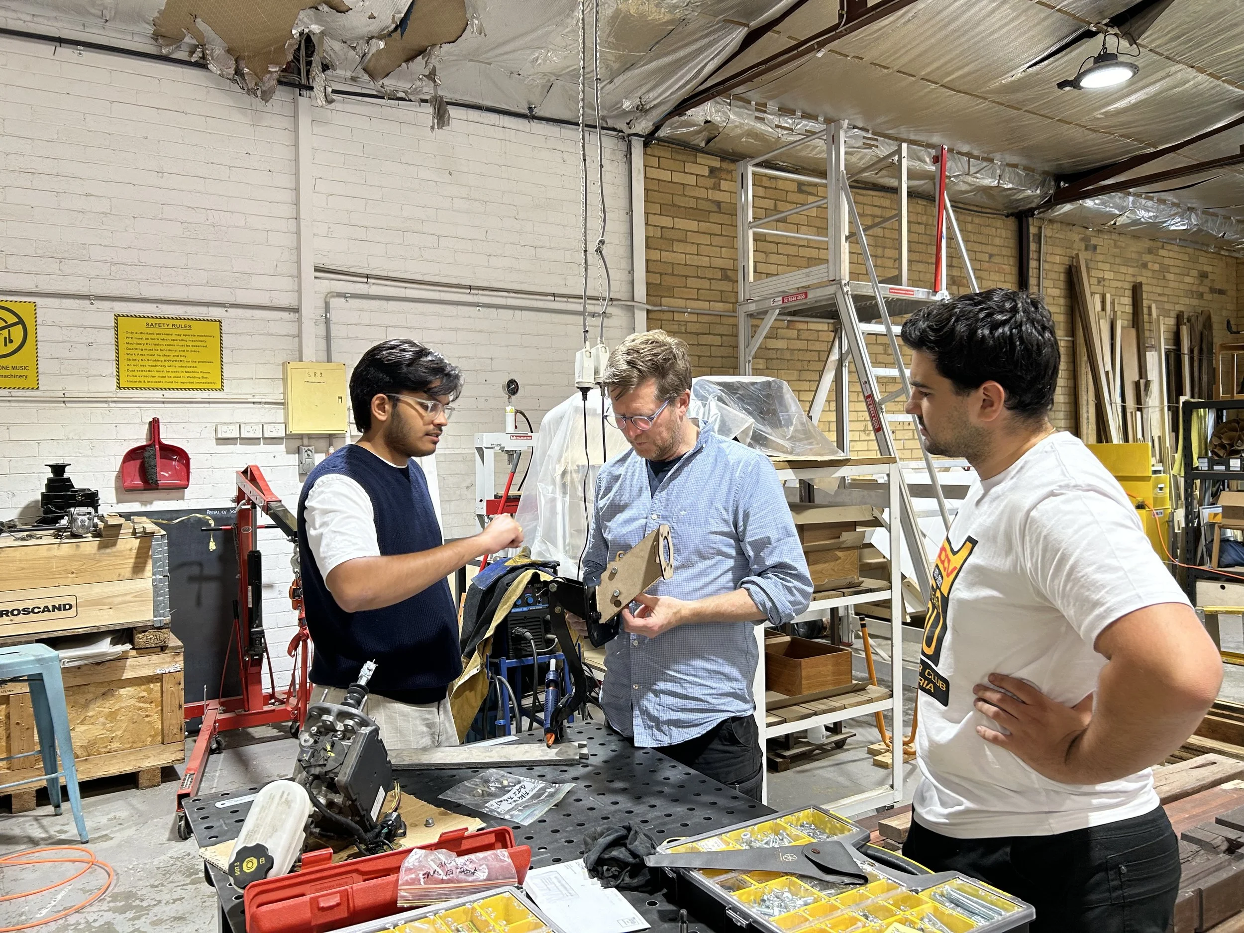 Swinburne engineering interns working on the BMW 2002 EV conversion